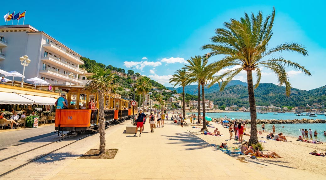 Port de Soller beach with brass vintage Train Majorca, Spain